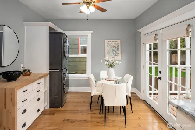 a view of a dining room with furniture window and wooden floor
