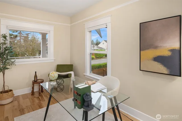 a dining room with furniture and window