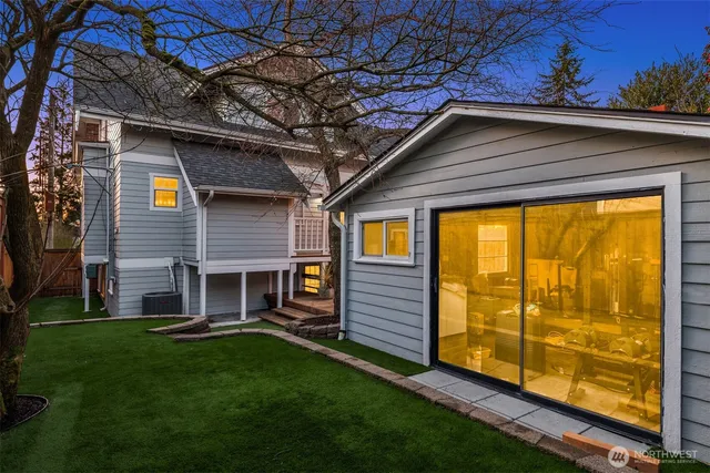 a view of a house with a backyard