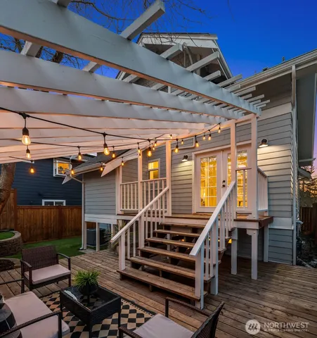 a roof deck with furniture and wooden floor