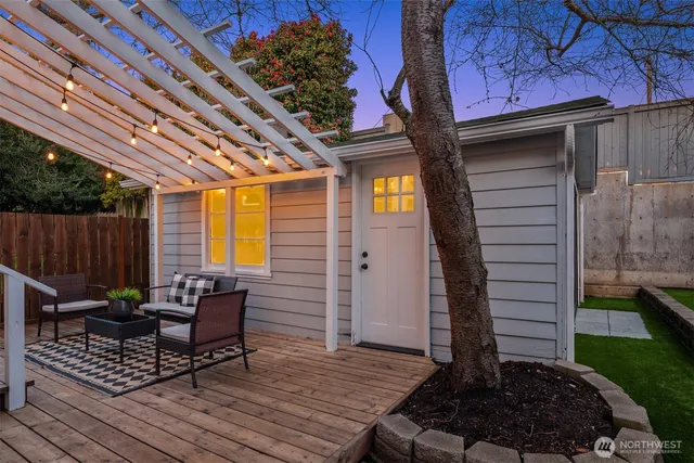 a view of a backyard with sitting area