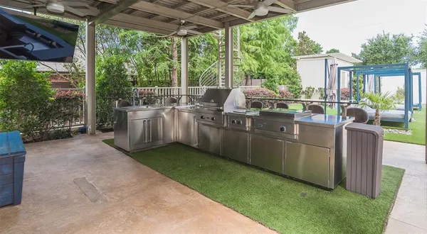 a view of a backyard with sitting area