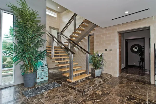 a view of a hallway with seating space