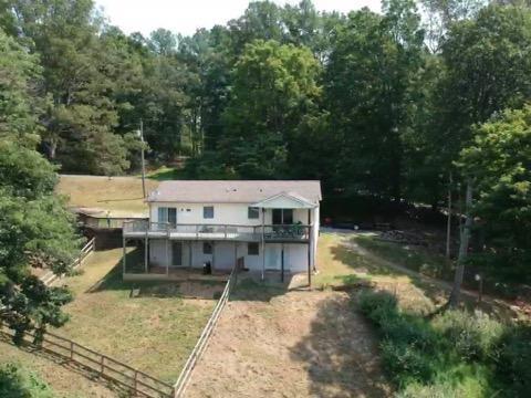 6331 Horseshoe Bend Road Goodview, VA 24095 - Photo 14 of 75 a view of a deck with chairs and a yard