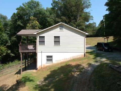 6331 Horseshoe Bend Road Goodview, VA 24095 - Photo 17 of 75 a view of a house with a yard