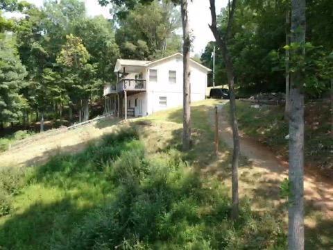 6331 Horseshoe Bend Road Goodview, VA 24095 - Photo 20 of 75 a backyard of a house with lots of green space