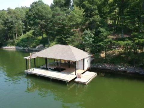 6331 Horseshoe Bend Road Goodview, VA 24095 - Photo 25 of 75 a view of a swimming pool with lounge chair