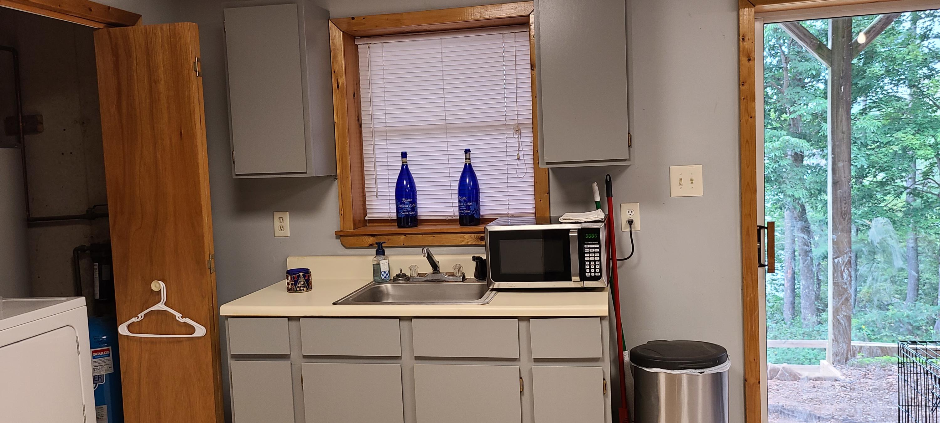 6331 Horseshoe Bend Road Goodview, VA 24095 - Photo 28 of 75 a bathroom with a sink and a mirror
