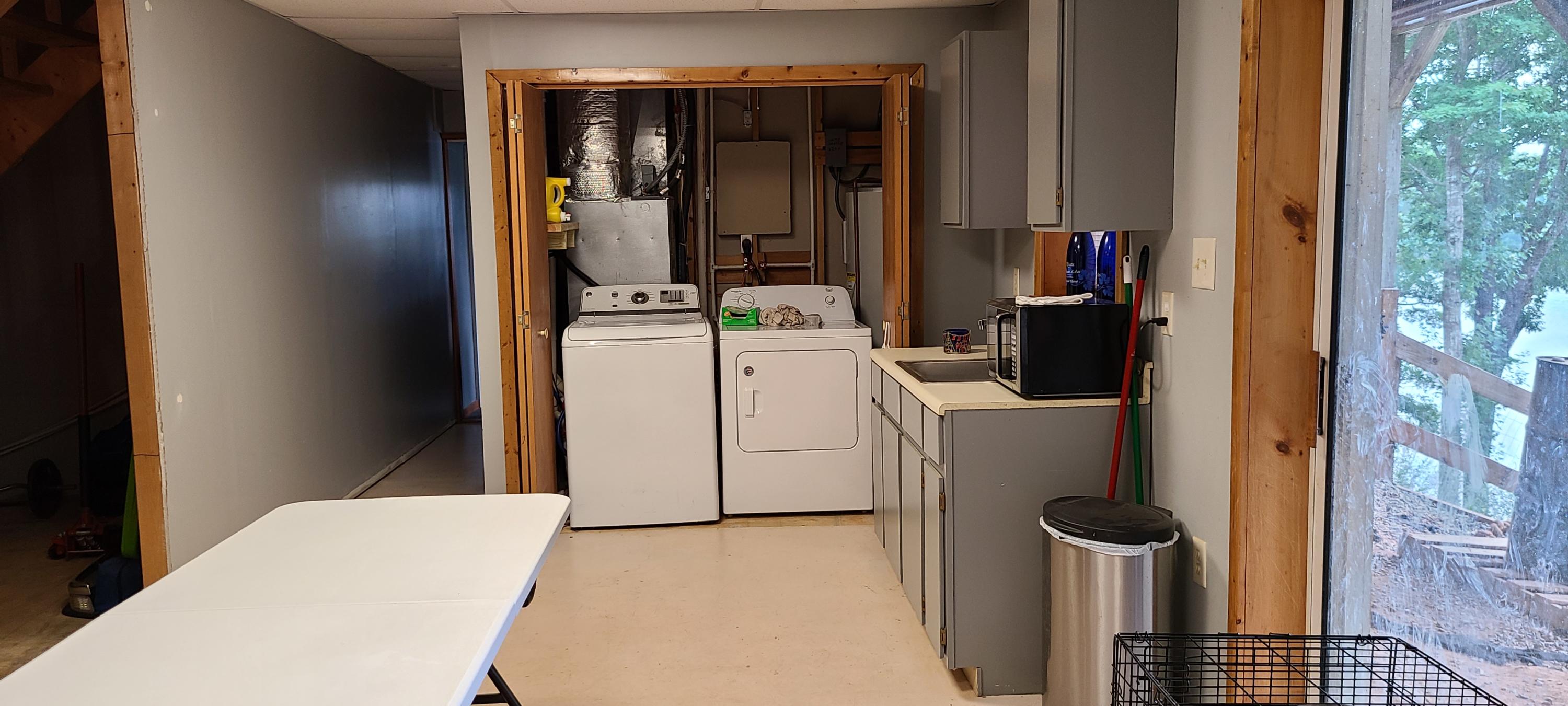 6331 Horseshoe Bend Road Goodview, VA 24095 - Photo 29 of 75 a utility room with dryer and washer