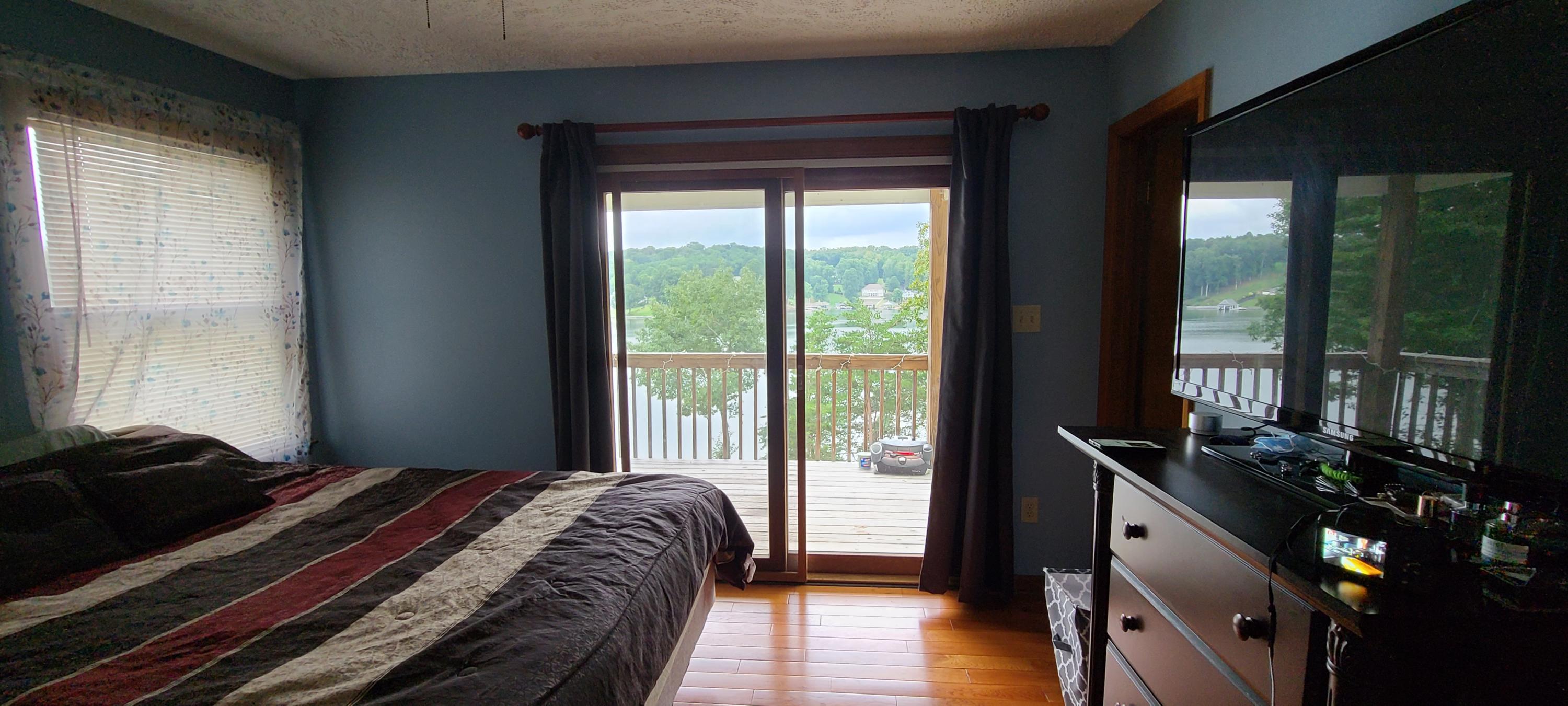 6331 Horseshoe Bend Road Goodview, VA 24095 - Photo 41 of 75 a bedroom with a bed and wooden floor