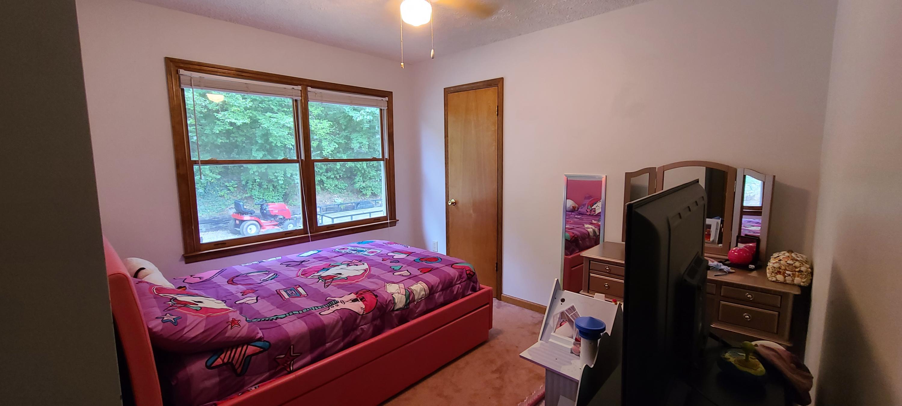 6331 Horseshoe Bend Road Goodview, VA 24095 - Photo 43 of 75 a bedroom with a bed closet and a window