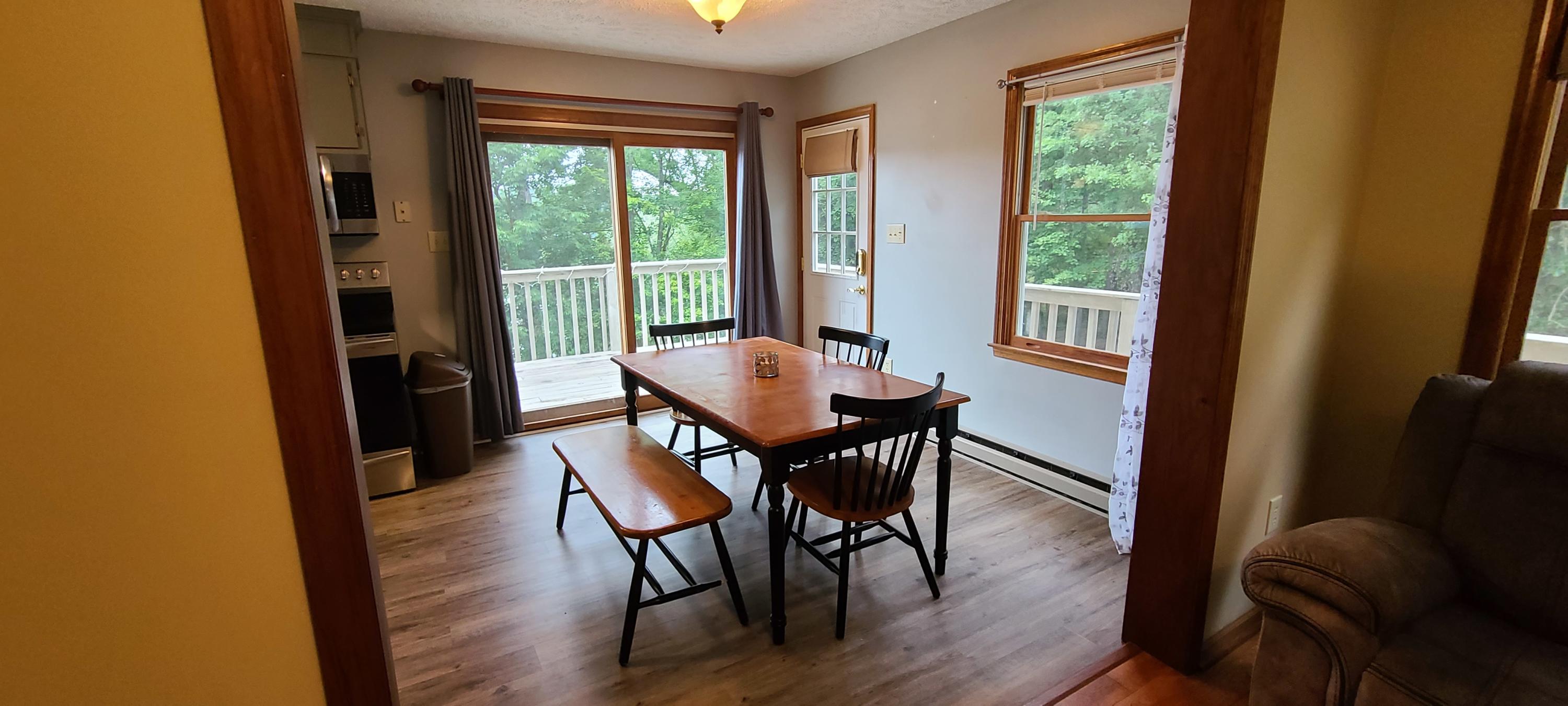 6331 Horseshoe Bend Road Goodview, VA 24095 - Photo 51 of 75 a view of a dining room with furniture window and wooden floor