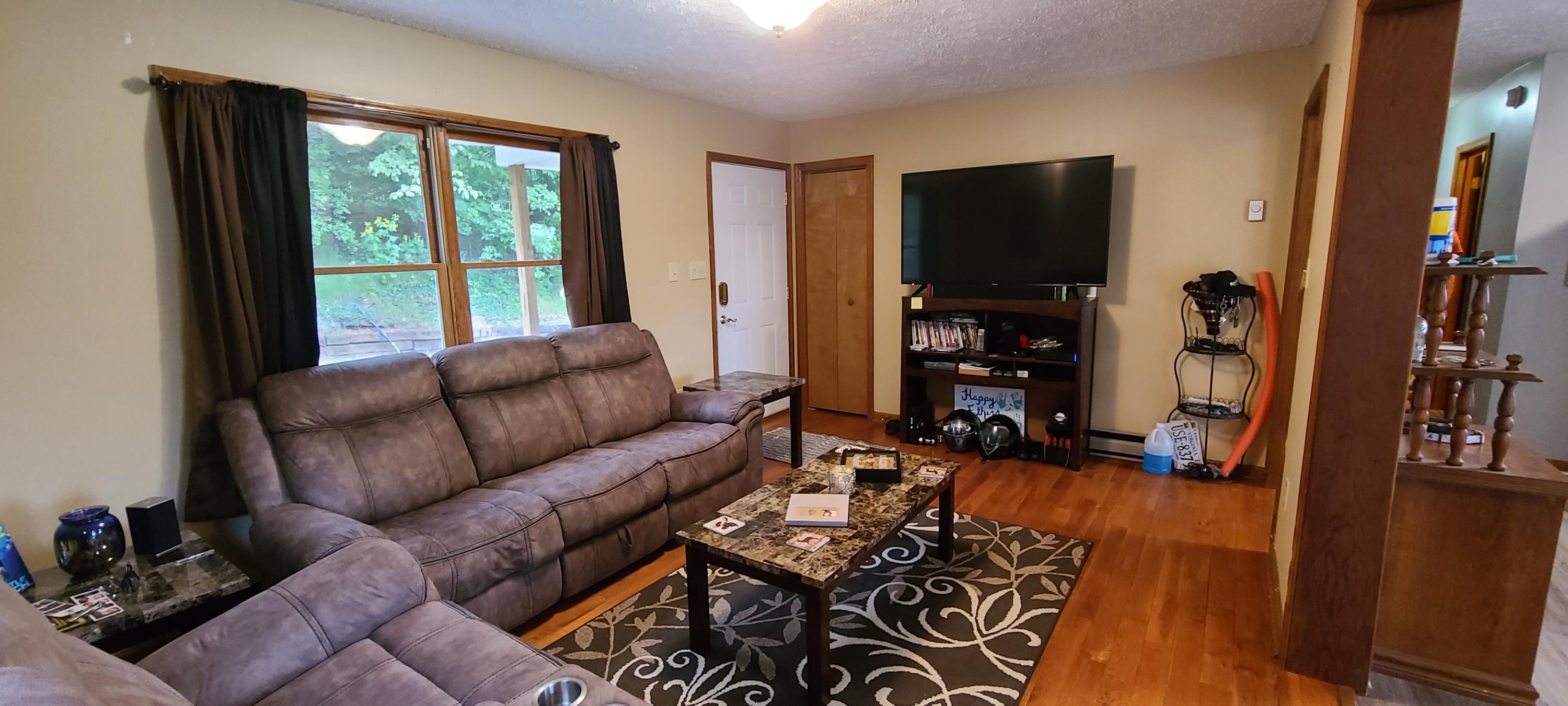 6331 Horseshoe Bend Road Goodview, VA 24095 - Photo 54 of 75 a living room with furniture tv and a window