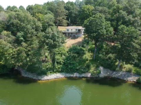 6331 Horseshoe Bend Road Goodview, VA 24095 - Photo 57 of 75 a view of a lake with a house in the background
