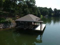 6331 Horseshoe Bend Road Goodview, VA 24095 - Photo 69 of 75 a view of a wooden chairs and table in the lake