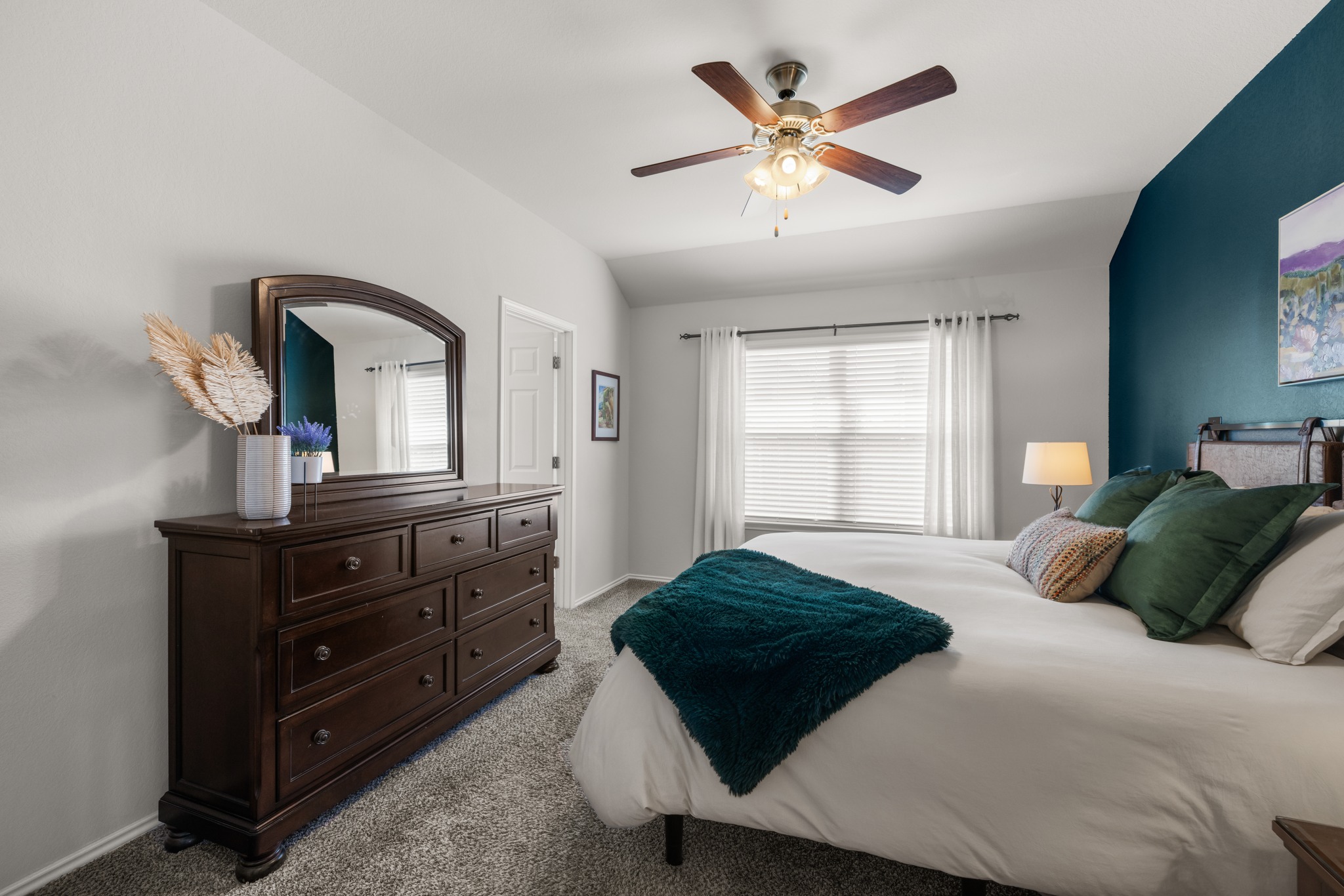 219 Noddy Road Buda, TX 78610 - Photo 21 of 31 Bedroom featuring lofted ceiling, light carpet, and ceiling fan