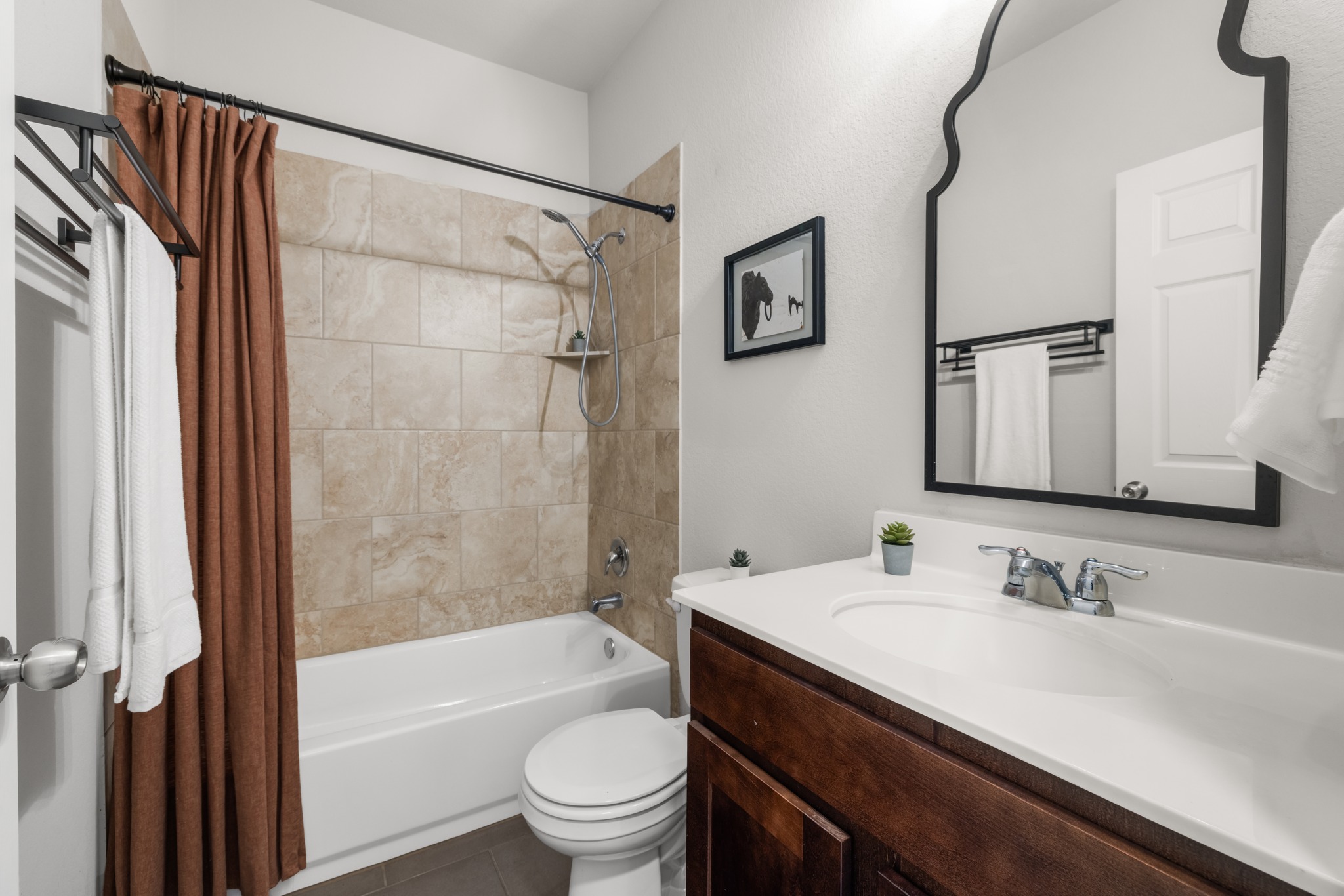 219 Noddy Road Buda, TX 78610 - Photo 25 of 31 Bathroom featuring vanity and shower / bath combo