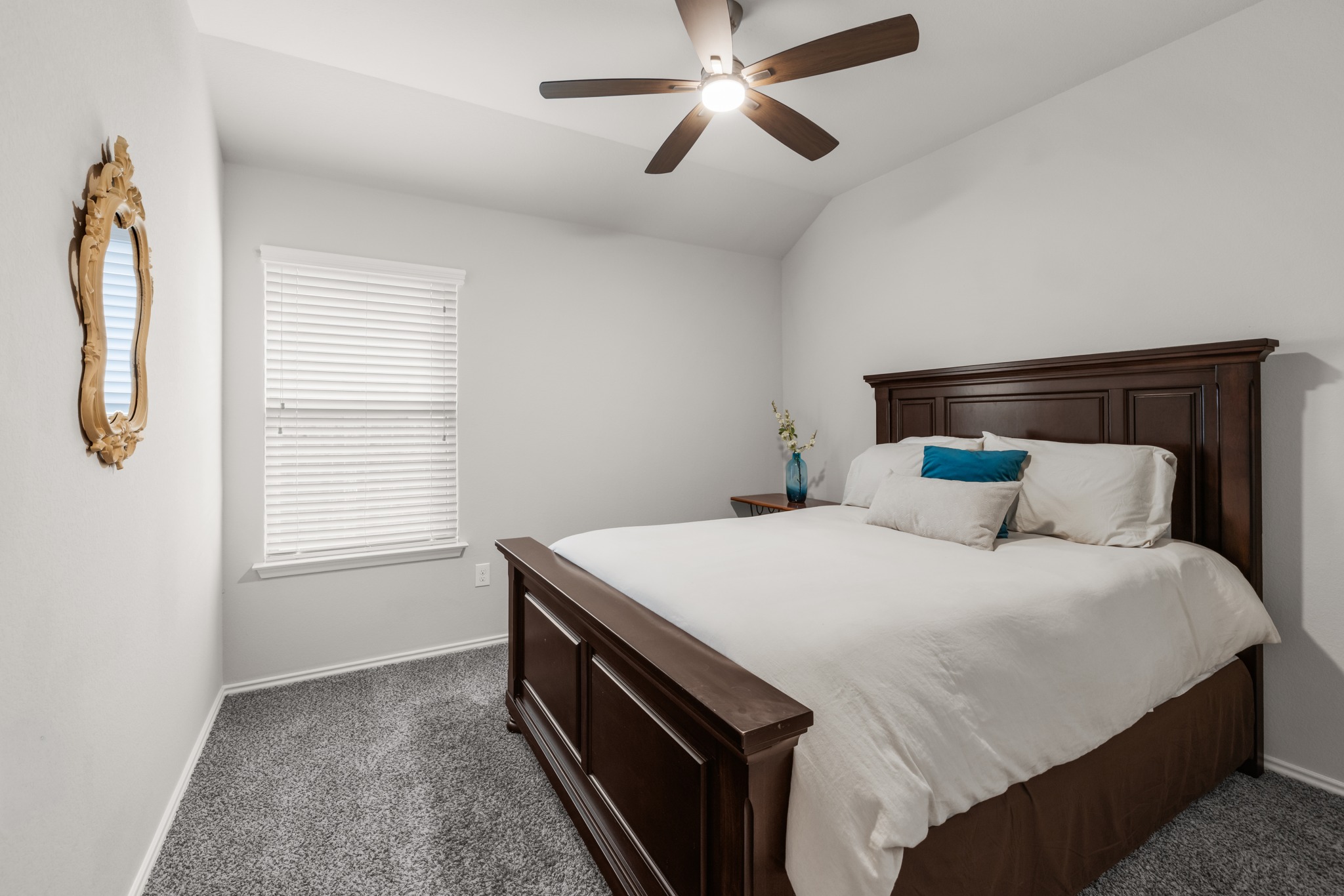 219 Noddy Road Buda, TX 78610 - Photo 26 of 31 Bedroom with dark carpet, a ceiling fan, and lofted ceiling