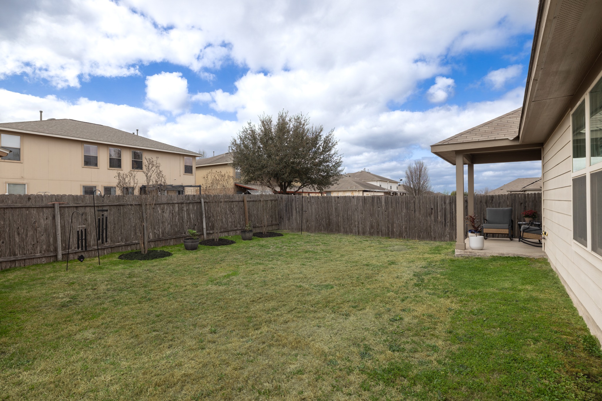219 Noddy Road Buda, TX 78610 - Photo 30 of 31 Fenced backyard featuring a patio