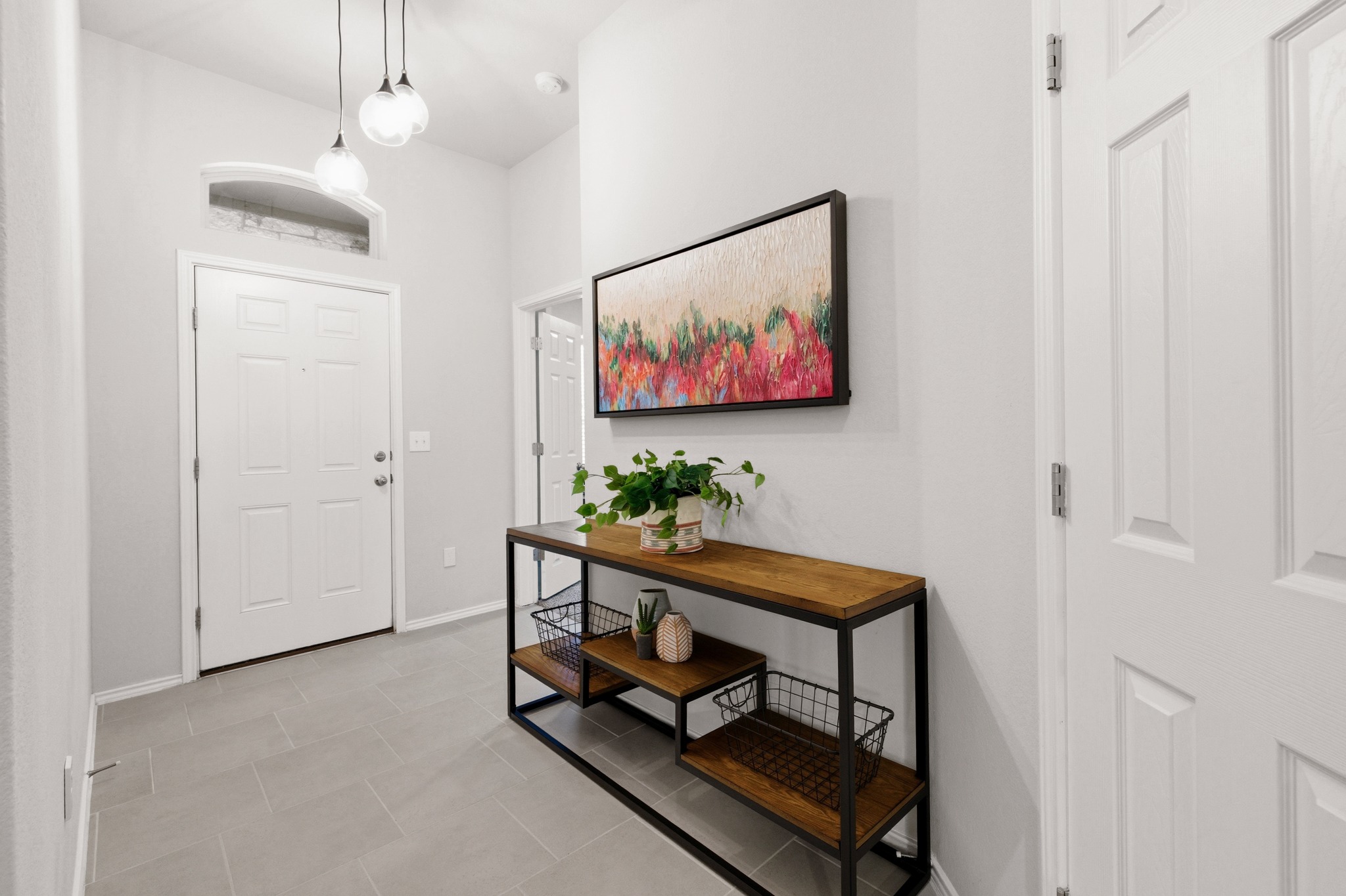 219 Noddy Road Buda, TX 78610 - Photo 6 of 31 Foyer featuring baseboards and light tile patterned floors