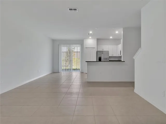a view of a kitchen with a sink and cabinets