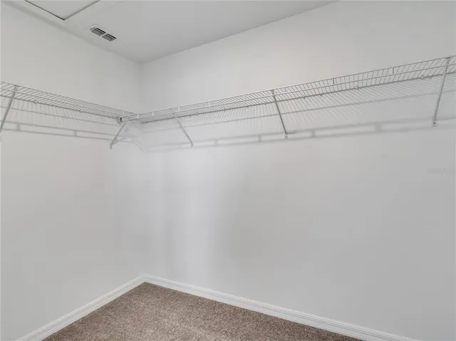 a view of a room with racks on the wall