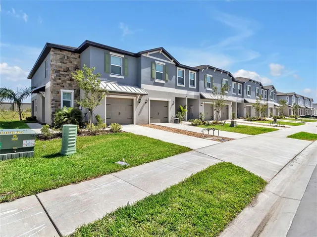 a front view of building with yard