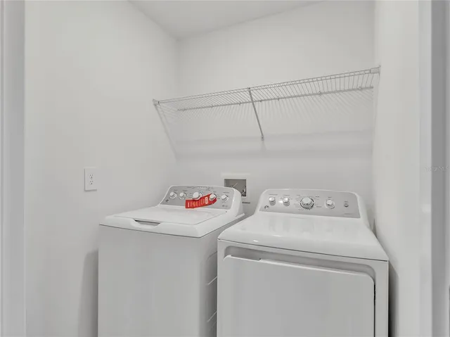 a utility room with dryer and washer