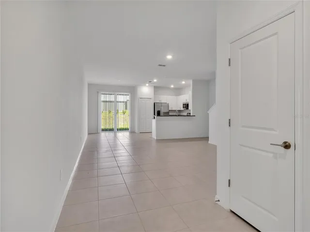 a view of a kitchen with a sink and cabinets