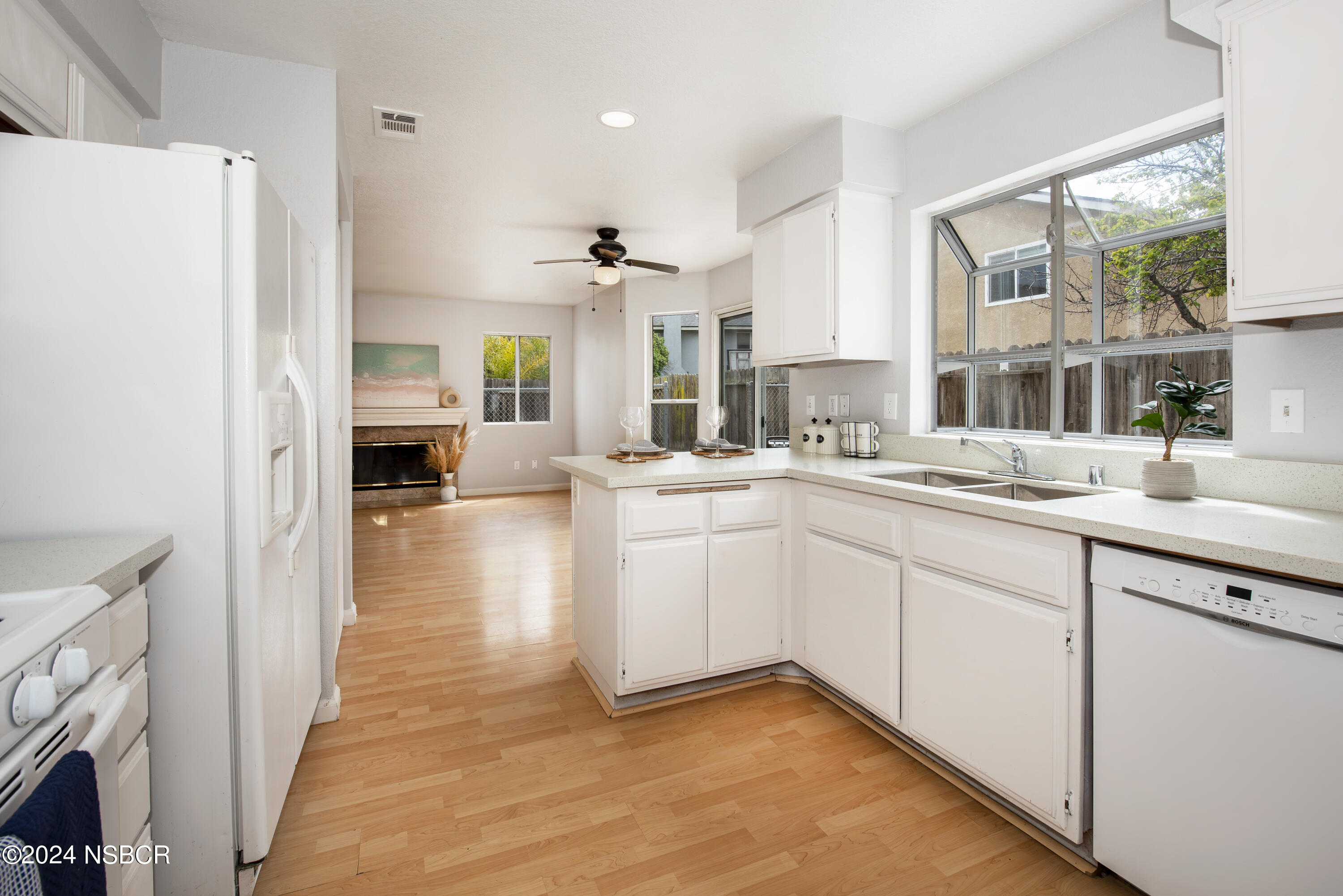 1341 Lloyd Place Lompoc, CA 93436 - Photo 8 of 20 a kitchen with a refrigerator and a sink