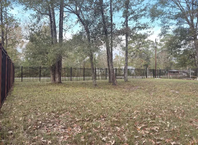 a backyard of a house with lots of green space