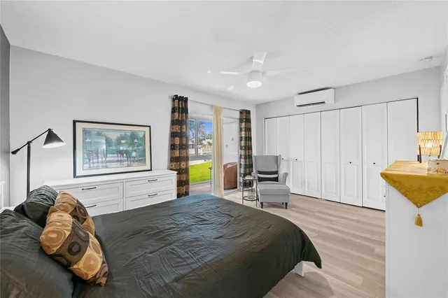 a spacious bedroom with a bed and a couch