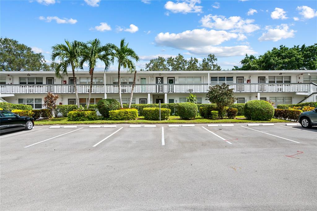 318 Oakridge R, Unit 318 Deerfield Beach, FL 33442 - Photo 23 of 26 a view of street with cars