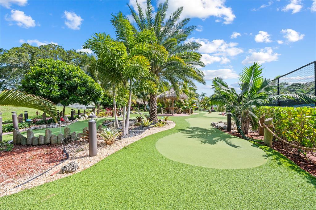318 Oakridge R, Unit 318 Deerfield Beach, FL 33442 - Photo 26 of 26 a view of a backyard with plants and outdoor seating