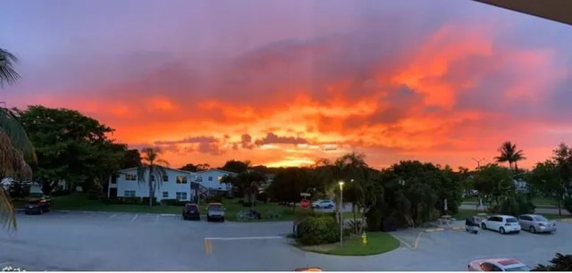 a view of a street with a building in the background