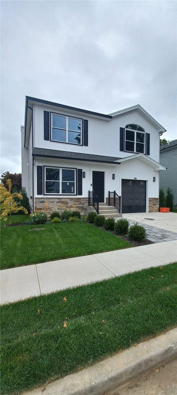 190 Lexington Avenue Franklin Square, NY 11010 - Photo 1 of 1 View of front facade with a garage, central AC, and a front yard