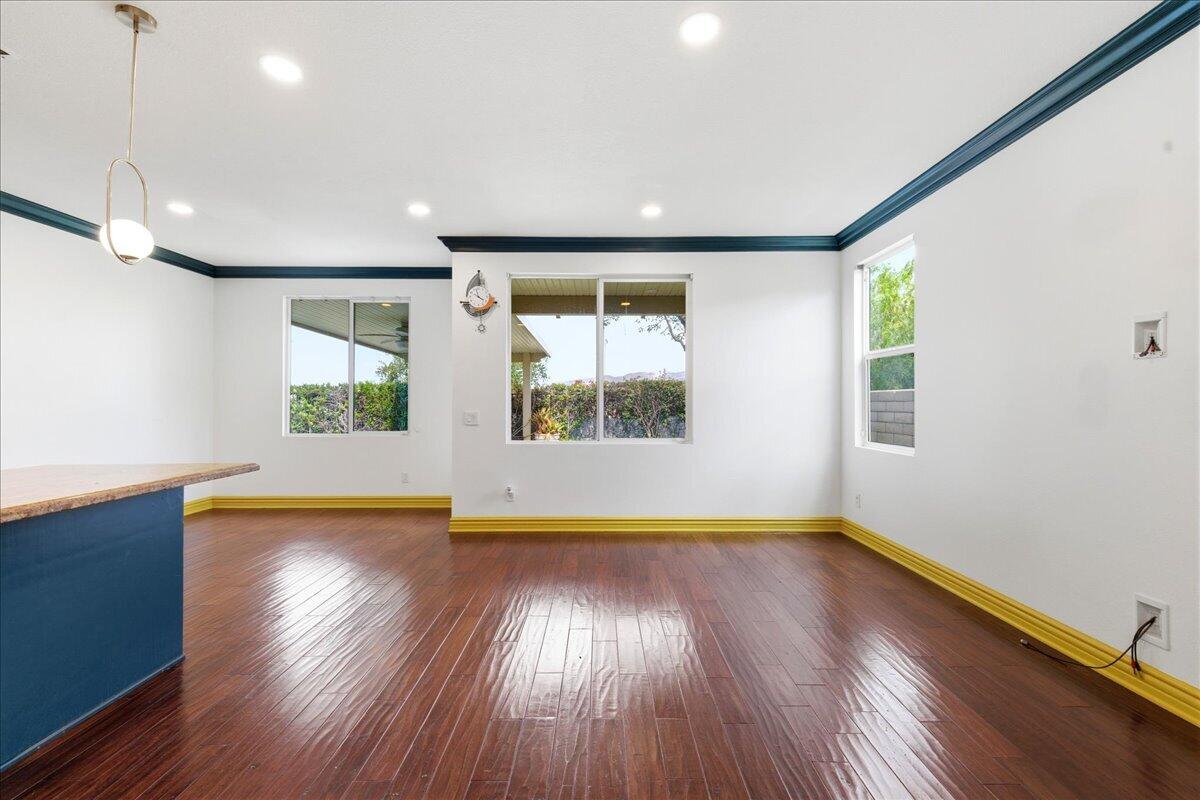 23732 Bella Vista Road Corona, CA 92883 - Photo 13 of 49 a view of an empty room with wooden floor and a window