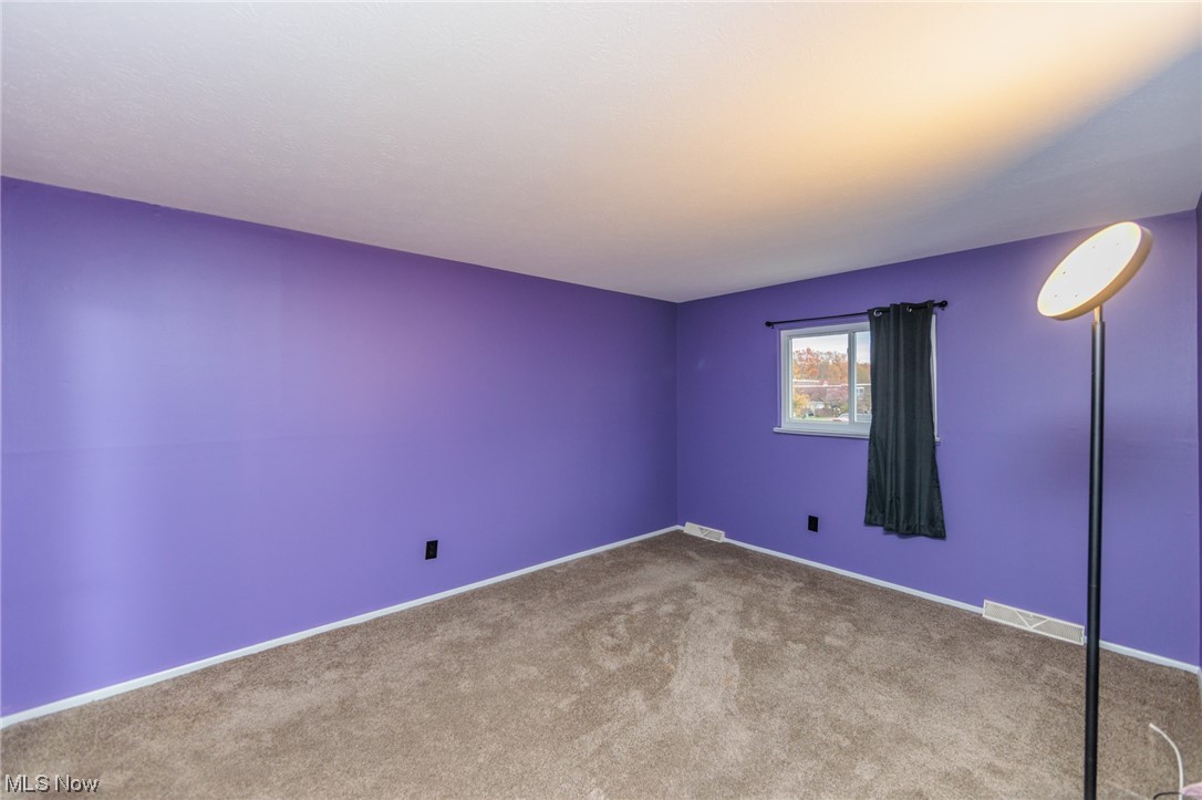 6472 State Road, Unit J19 Parma, OH 44134 - Photo 22 of 33 View of carpeted empty room