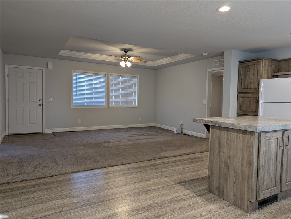 1658 Jaramillo Lane Paradise, CA 95969 - Photo 14 of 54 en empty room with windows and ceiling fan