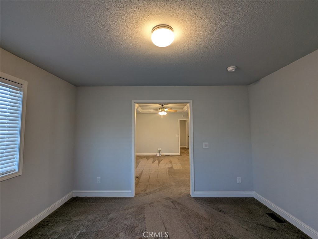 1658 Jaramillo Lane Paradise, CA 95969 - Photo 19 of 54 an empty room with wooden door and windows