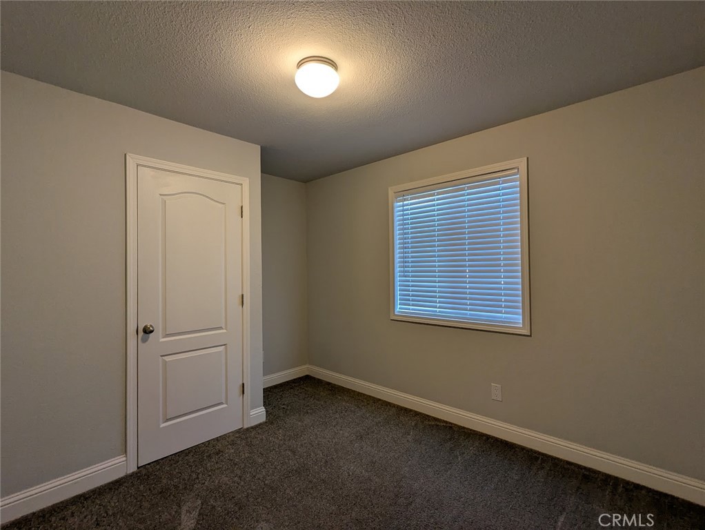 1658 Jaramillo Lane Paradise, CA 95969 - Photo 28 of 54 an empty room with windows