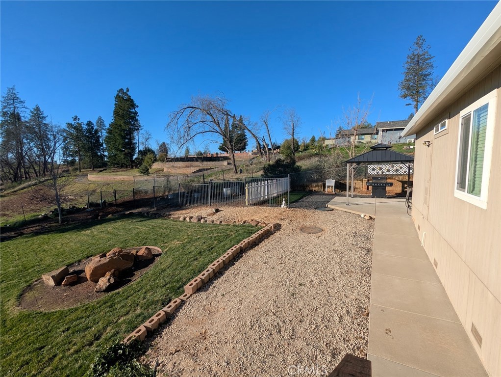 1658 Jaramillo Lane Paradise, CA 95969 - Photo 39 of 54 a view of a house with a yard and sitting area
