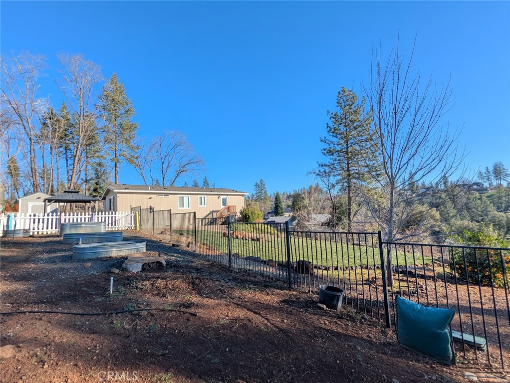 1658 Jaramillo Lane Paradise, CA 95969 - Photo 41 of 54 a view of a backyard with iron fence