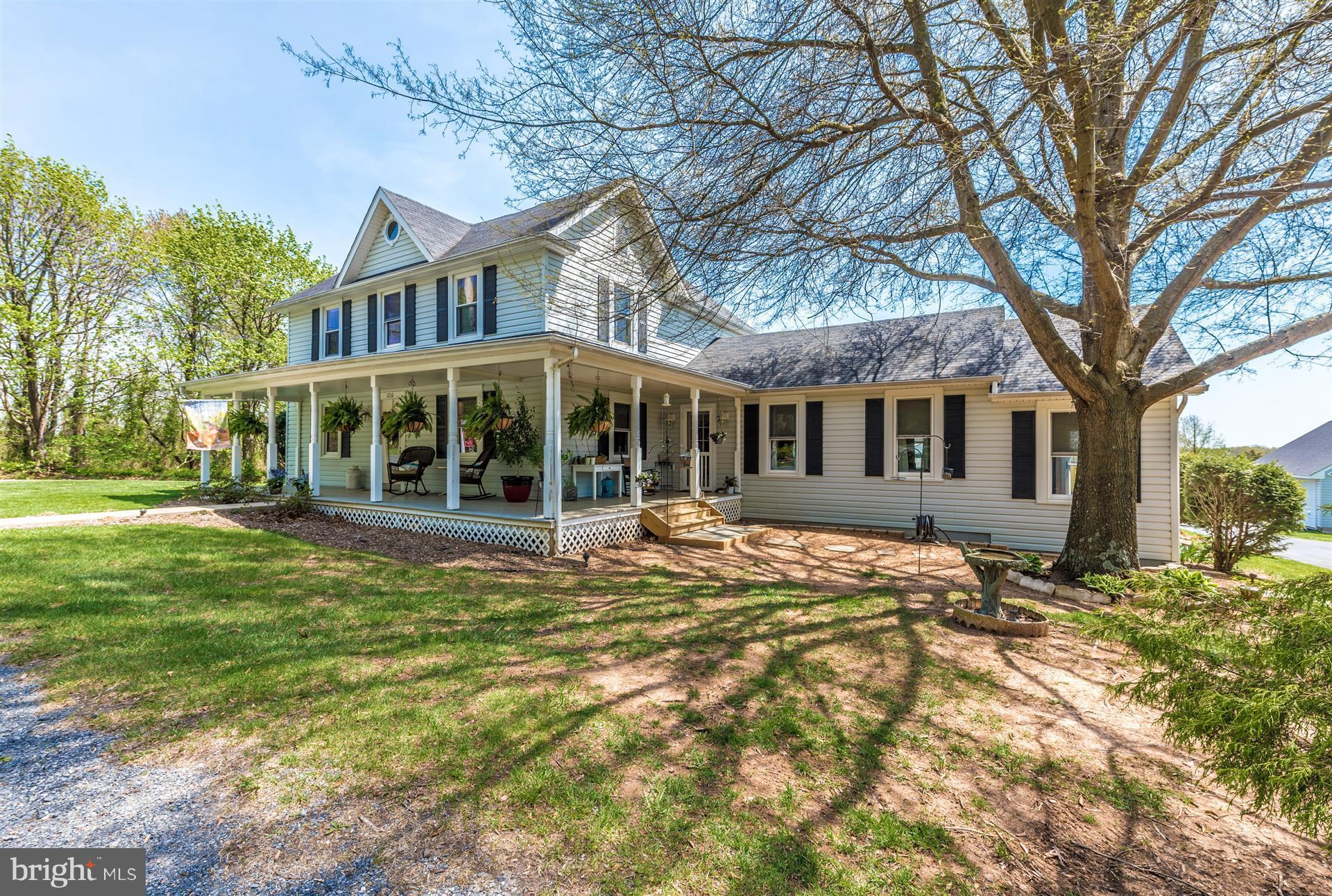 1210 Florence Road Mount Airy, MD 21771 - Photo 1 of 30 a view of a house with a large tree and a yard