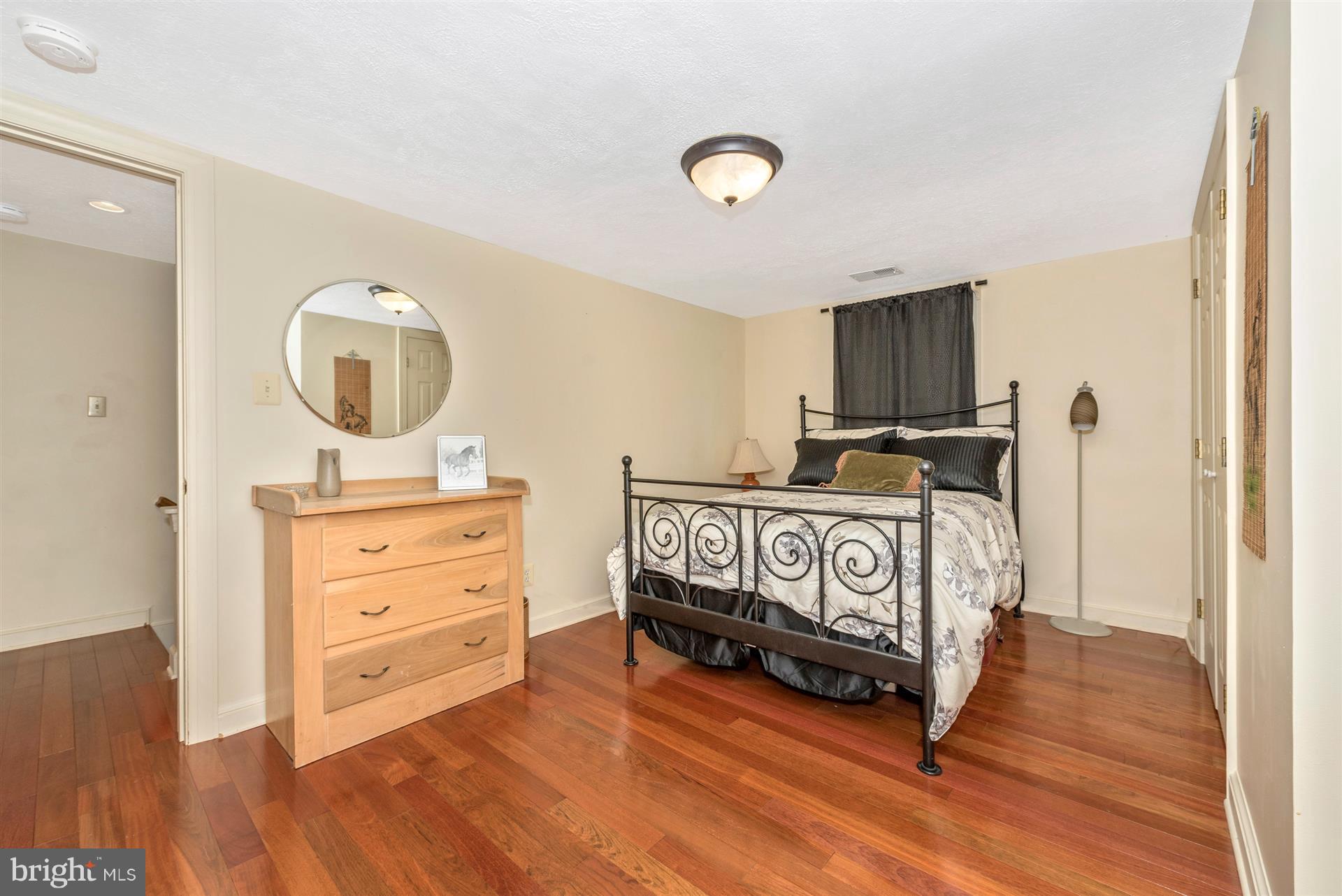1210 Florence Road Mount Airy, MD 21771 - Photo 14 of 30 a bedroom with furniture and a mirror