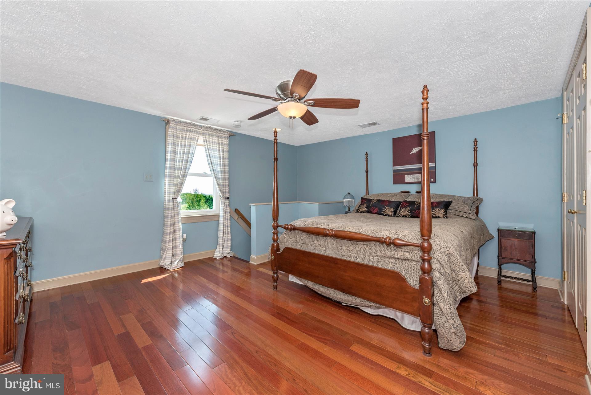 1210 Florence Road Mount Airy, MD 21771 - Photo 16 of 30 a bedroom with a bed and a chandelier