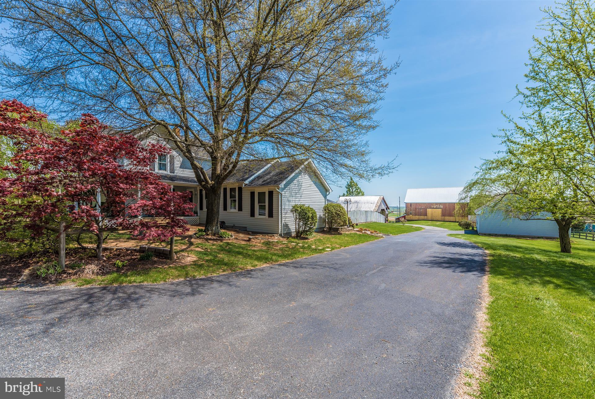 1210 Florence Road Mount Airy, MD 21771 - Photo 3 of 30 a front view of a house with a yard and garage