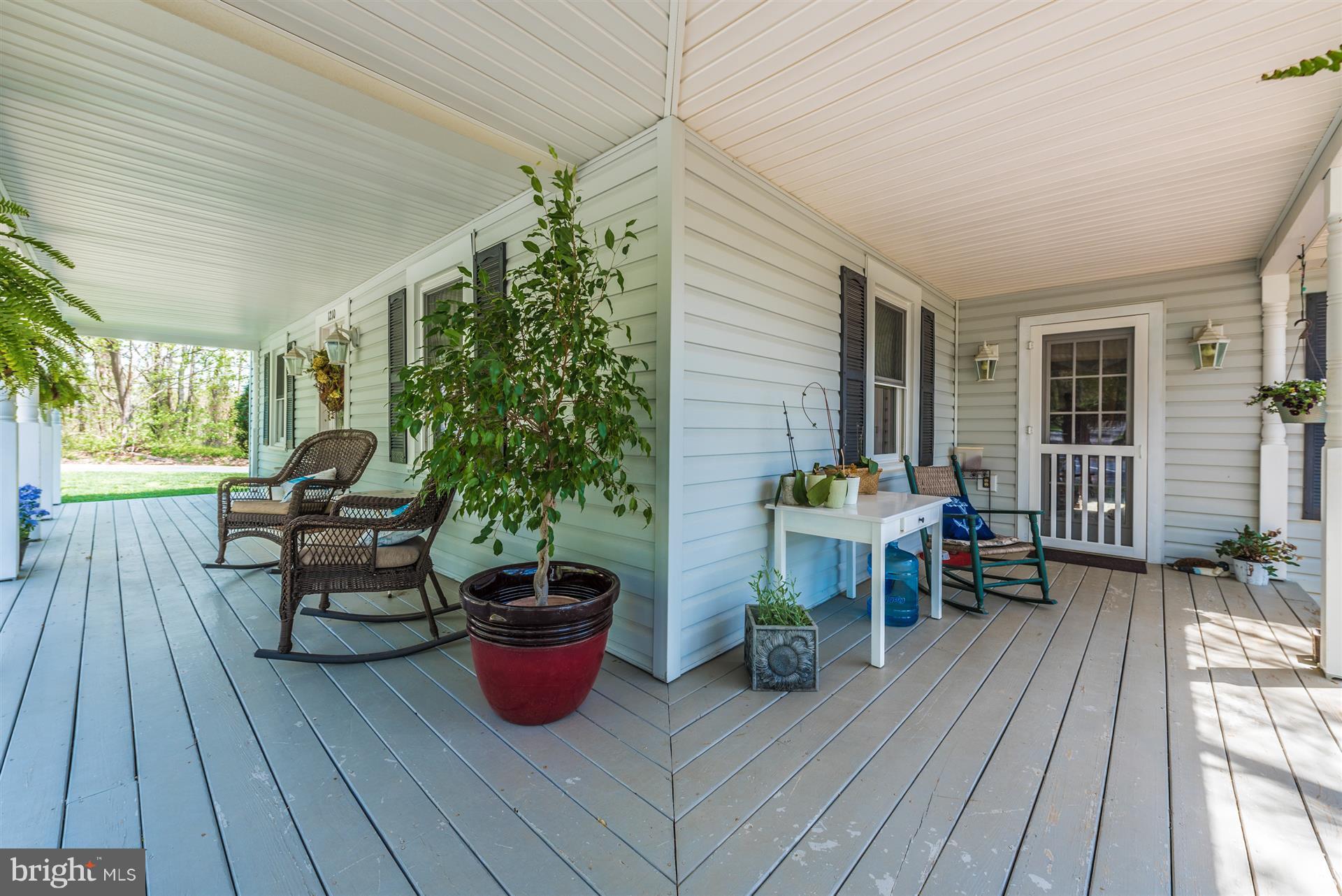 1210 Florence Road Mount Airy, MD 21771 - Photo 4 of 30 a sitting area with furniture and wooden floor