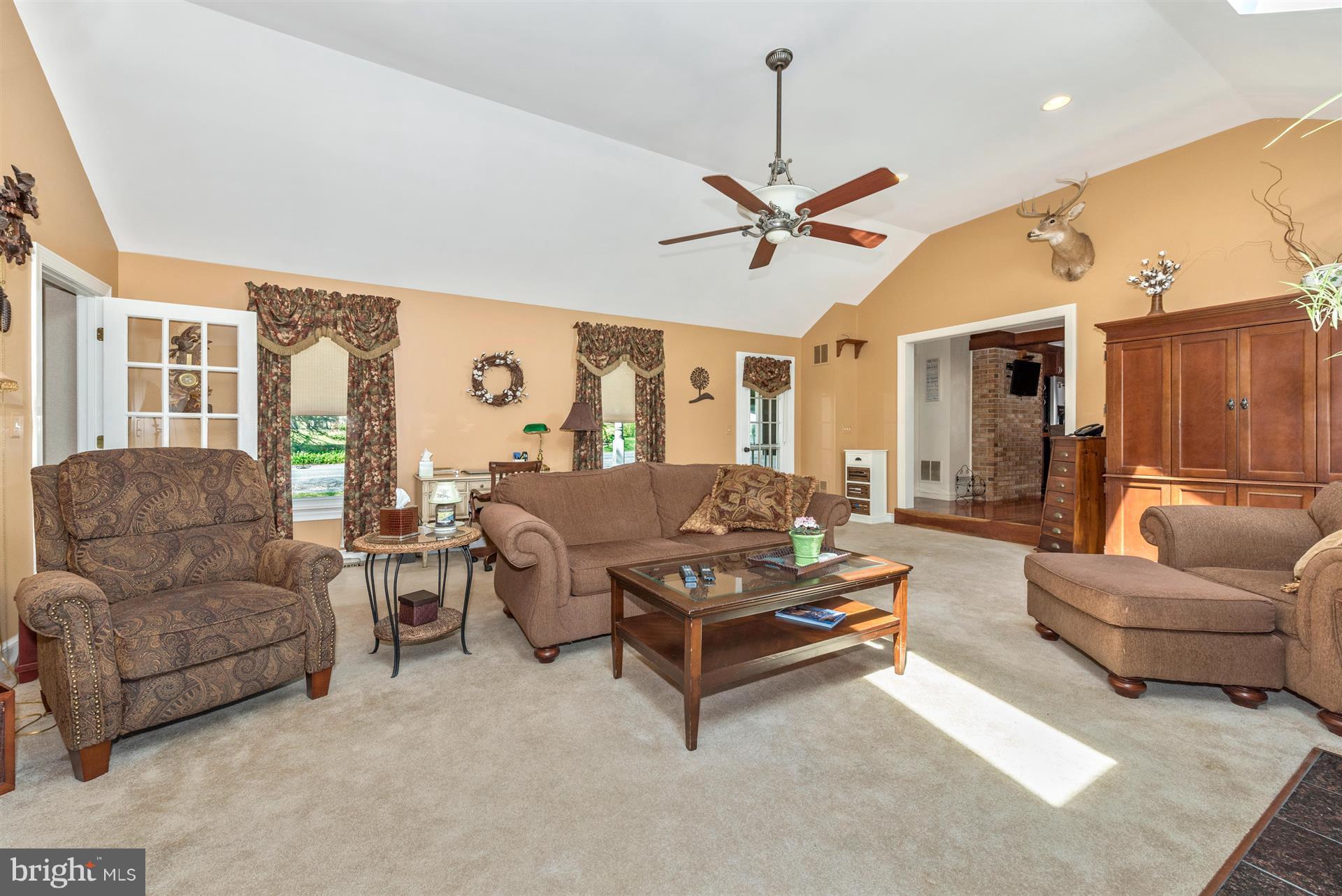 1210 Florence Road Mount Airy, MD 21771 - Photo 7 of 30 a living room with furniture ceiling fan and a rug
