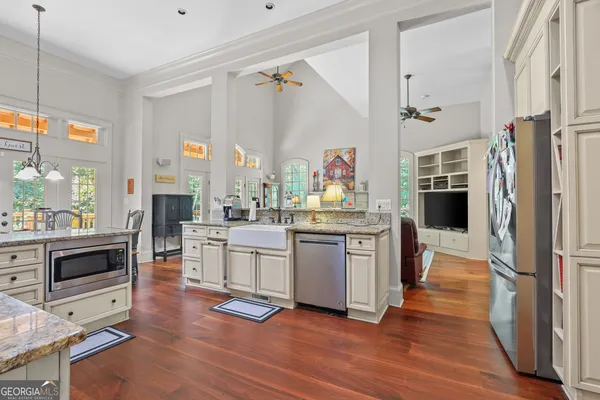 a view of a dining room with furniture and wooden floor